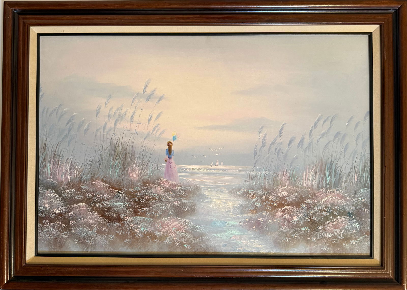 T. Stewart Romantic Coastal Landscape Oil Painting: Romantic coastal landscape oil painting depicting a figure standing along a seaside marsh path overlooking the water at sunset, signed T. Stewart lower right.Rendered in soft impressionistic tones