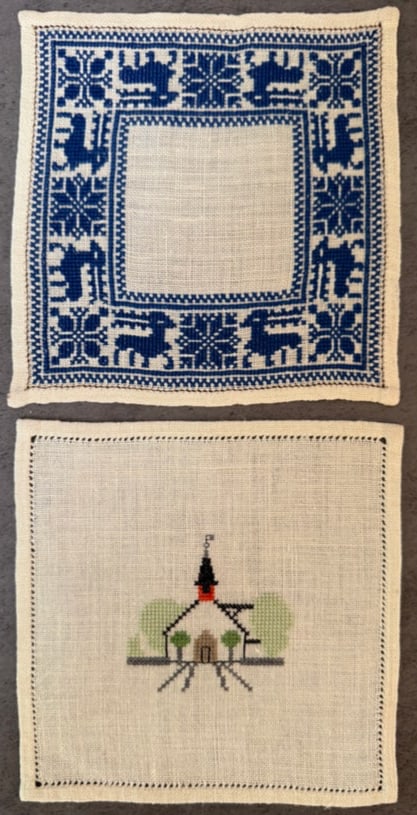 Two Vintage Hand Embroidered Needlepoint Textile Panels with Folk Motif and Church Scene: A pair of vintage hand-embroidered textile panels worked in needlepoint on linen canvas.One panel features a traditional folk-style geometric border with stylized animal motifs in blue thread