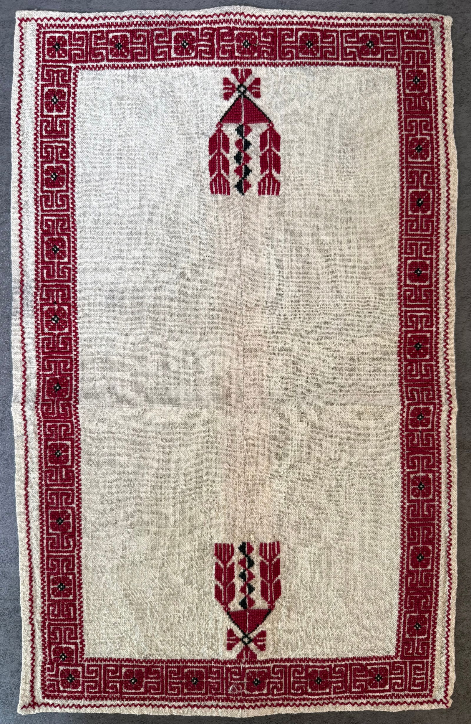 Vintage Eastern European Folk Hand Embroidered Linen Table Mat, Red & Black, 16 x 10 in: A vintage hand-embroidered linen textile featuring traditional Eastern European folk motifs worked in red and black thread.The piece displays a geometric Greek-key style border surrounding a central