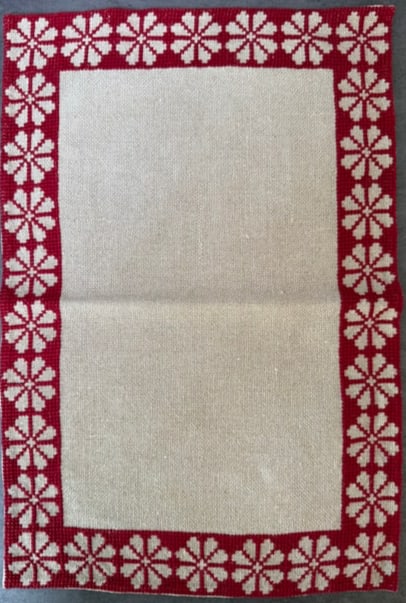 Vintage Eastern European Hand-Embroidered Linen Placemat, Red Floral Border, 19 x 12 in: Vintage hand-embroidered linen placemat featuring traditional Eastern European cross-stitch decoration. The design displays a red floral geometric border surrounding a natural linen center field,