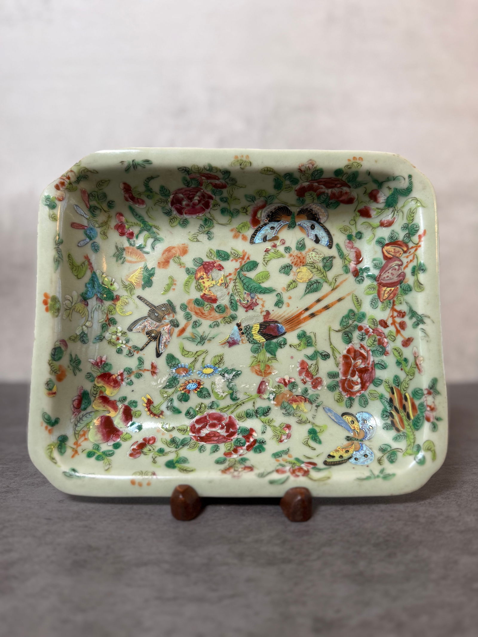 Chinese Famille Rose Porcelain Rectangular Tray, Early 20th Centur: Chinese porcelain rectangular tray decorated in famille rose enamels depicting birds, butterflies, and flowering branches on a pale celadon ground. The lively composition features colorful floral moti