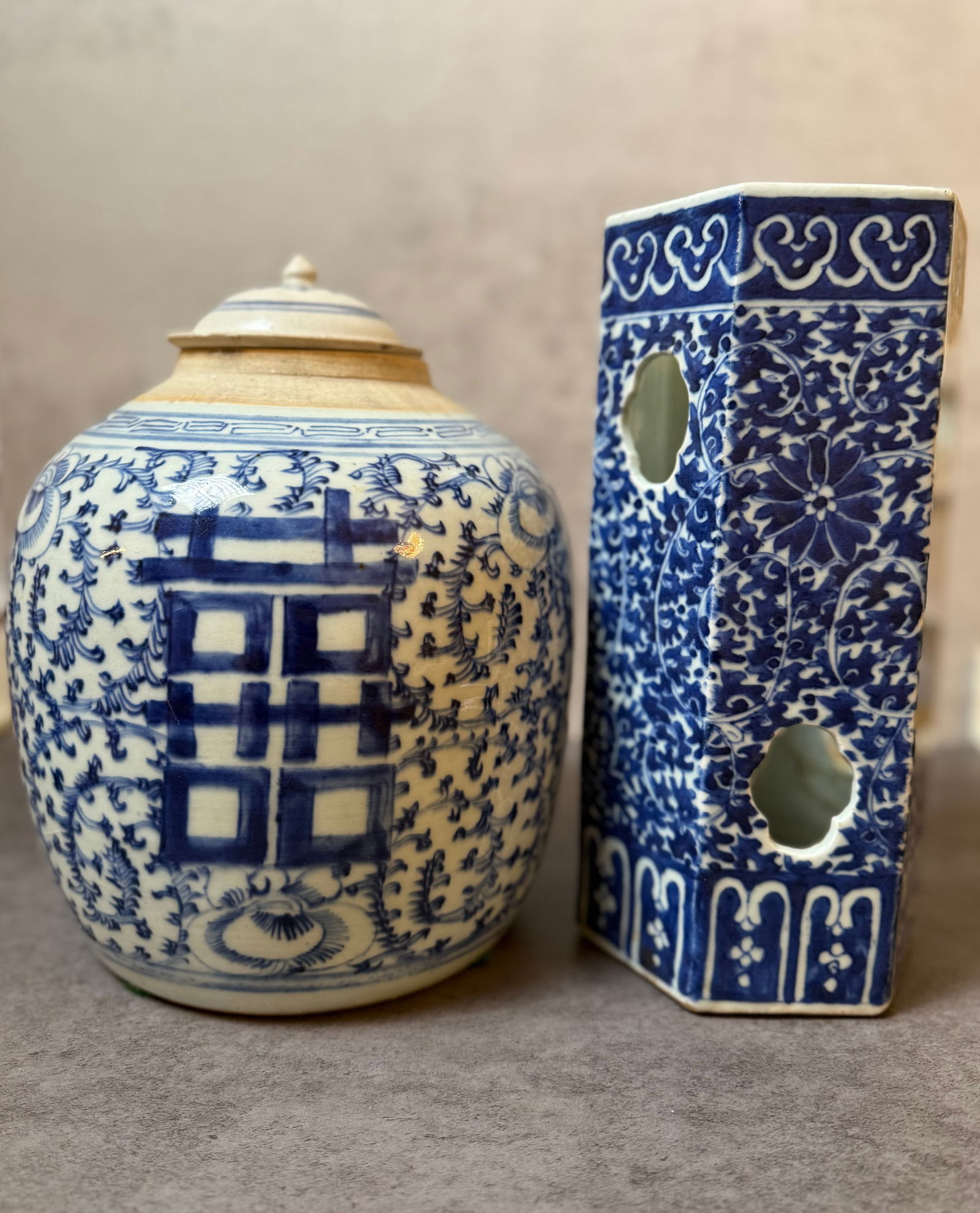 Chinese Blue & White Double Happiness Jar and Brush Holder: A group of two Chinese blue and white porcelain pieces including a covered jar decorated with the “Double Happiness” (Xi) character surrounded by scrolling floral motifs, and a square brush