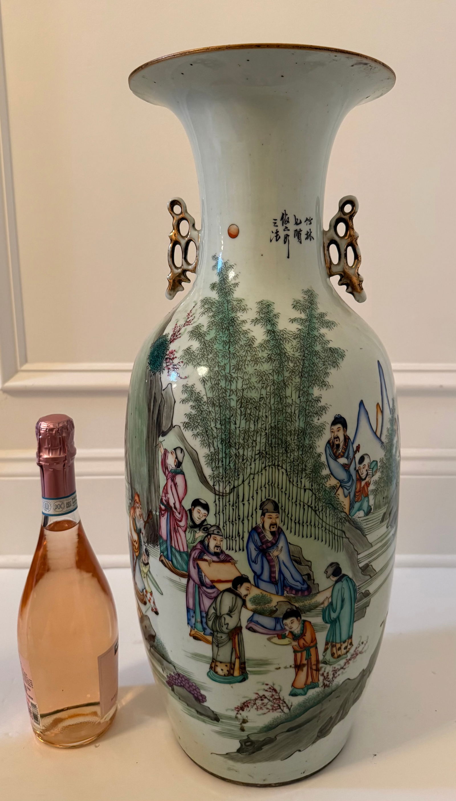 Large Chinese Famille Rose Porcelain Vase Depicting the Seven Sages of the Bamboo Grove: A Chinese porcelain vase decorated in famille rose enamels depicting a lively figural scene of scholars and attendants gathered in a bamboo garden landscape. The composition includes mountains,