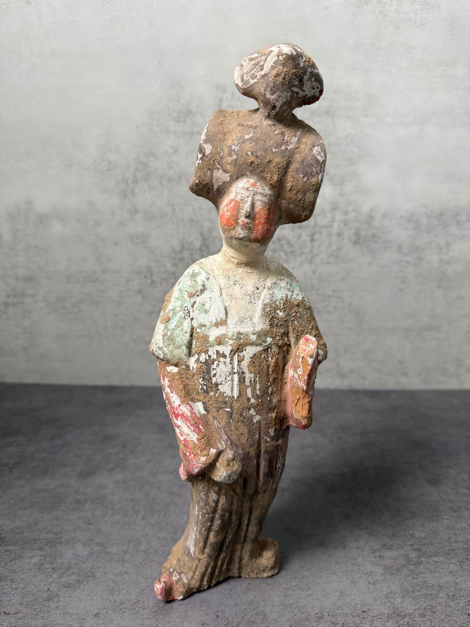 Chinese Tang Style Pottery Court Lady Figure: Chinese pottery figure depicting a standing court lady in the style of Tang dynasty tomb figures. The figure is shown wearing a long flowing robe with hands concealed within the sleeves, a posture