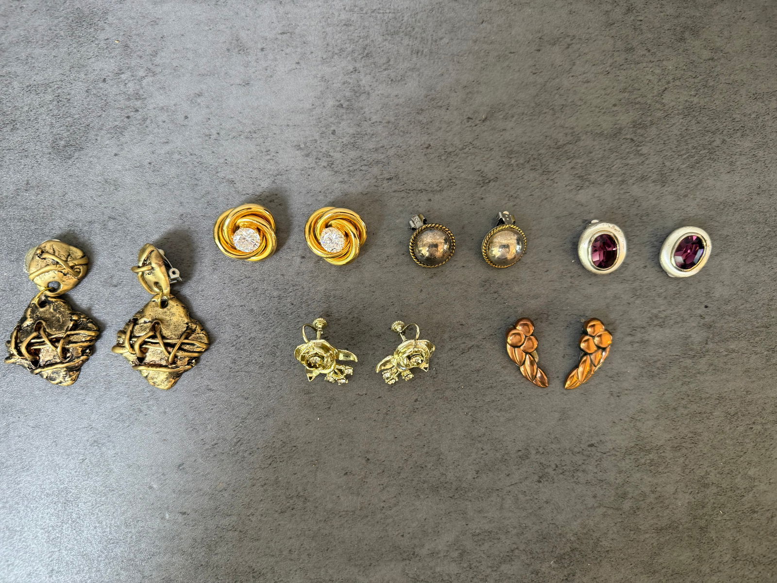 Lot of 6 Pairs Vintage Costume Earrings — Gold, Silver, Rhinestone, Amethyst Glass, Floral &: TITLE: Lot of 6 Pairs Vintage Costume Earrings — Gold, Silver, Rhinestone, Amethyst Glass, Floral & Brutalist styles, Clip & PostDESCRIPTION: A charming collection of six pairs of vintage costume