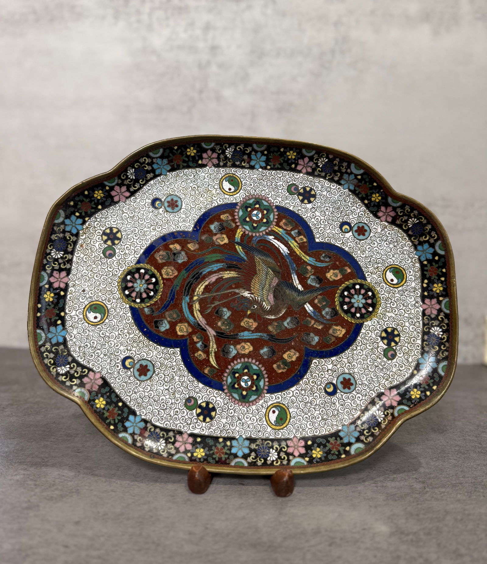 Antique Japanese Cloisonné Enamel Tray, Phoenix and Floral Design, Meiji Period: A Japanese cloisonné enamel (shippo) tray of shaped rectangular lobed form. Interior centering a flying phoenix on a rust-brown ground, surrounded by a dense white scrolling ground with floral and ro