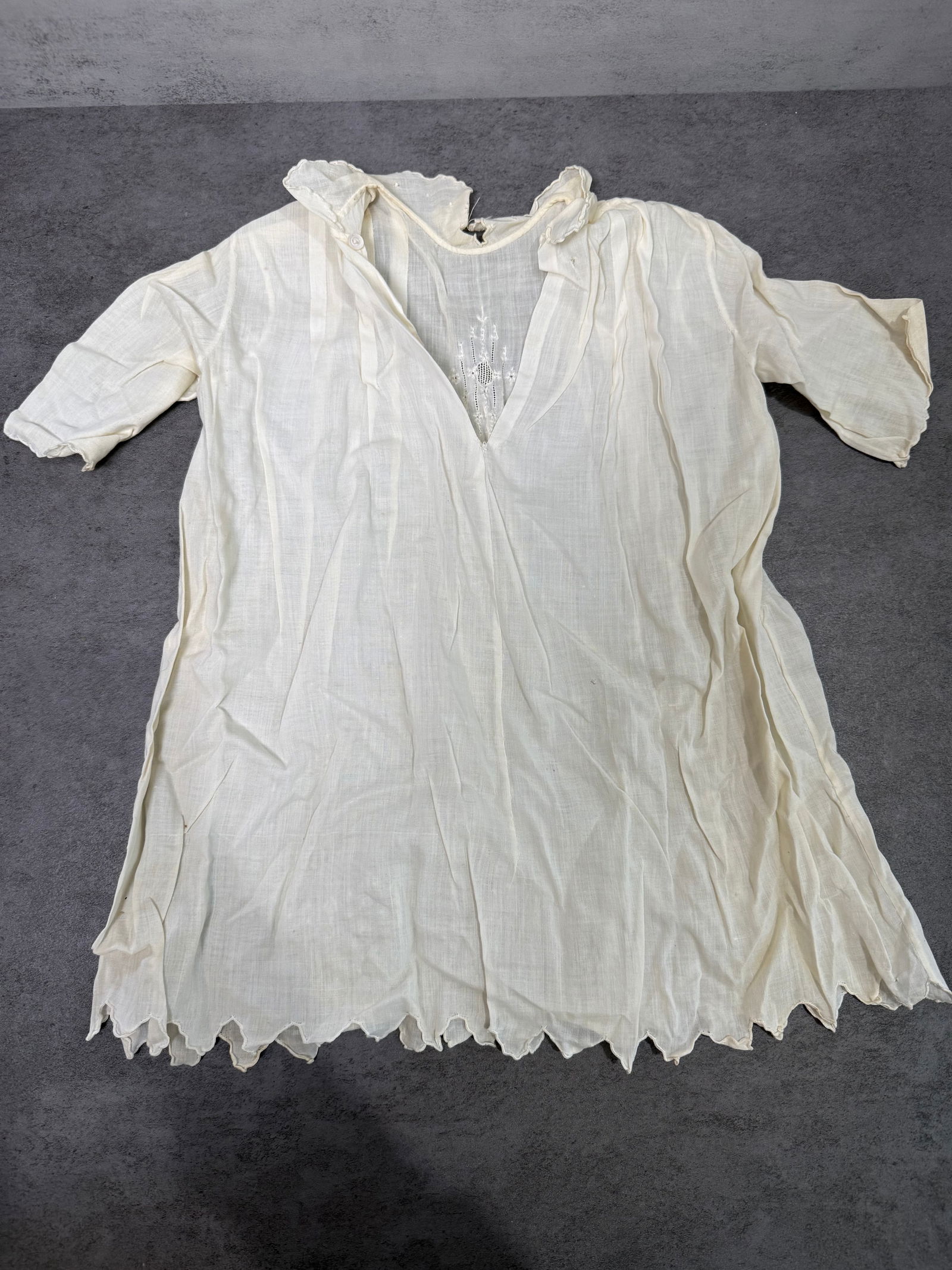 Antique Child White Cotton Lawn Nightgown Embroidered Distressed c.1900: Antique child's white cotton lawn nightgown or dress, circa 1890–1910. Short sleeves, V-neckline with ruffled collar and small button closure. Embroidered floral motif at center front placket. Note
