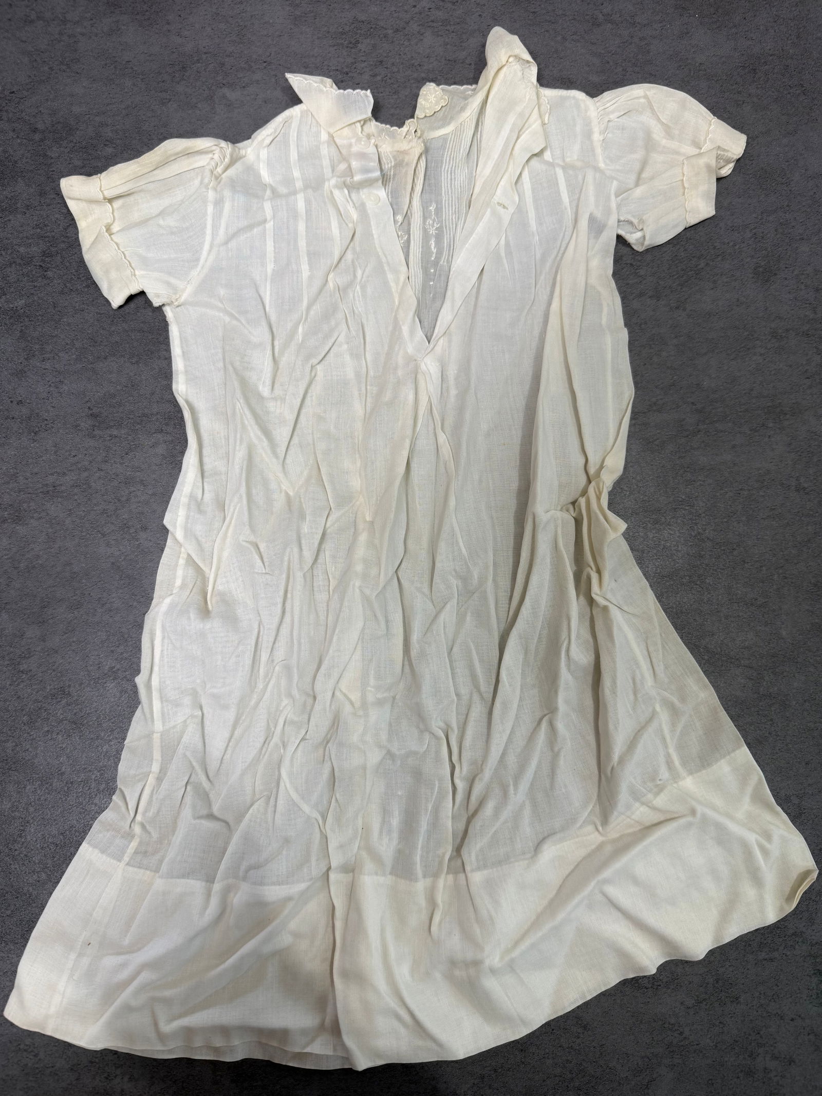 Antique Child White Cotton Lawn Nightgown Puff Sleeve Embroidered c.1900: Antique child's white cotton lawn nightgown or dress, circa 1890–1910. Features puffed short sleeves, V-neckline with ruffled lapel collar and lace trim, pin-tuck pleating at the chest, and embroide