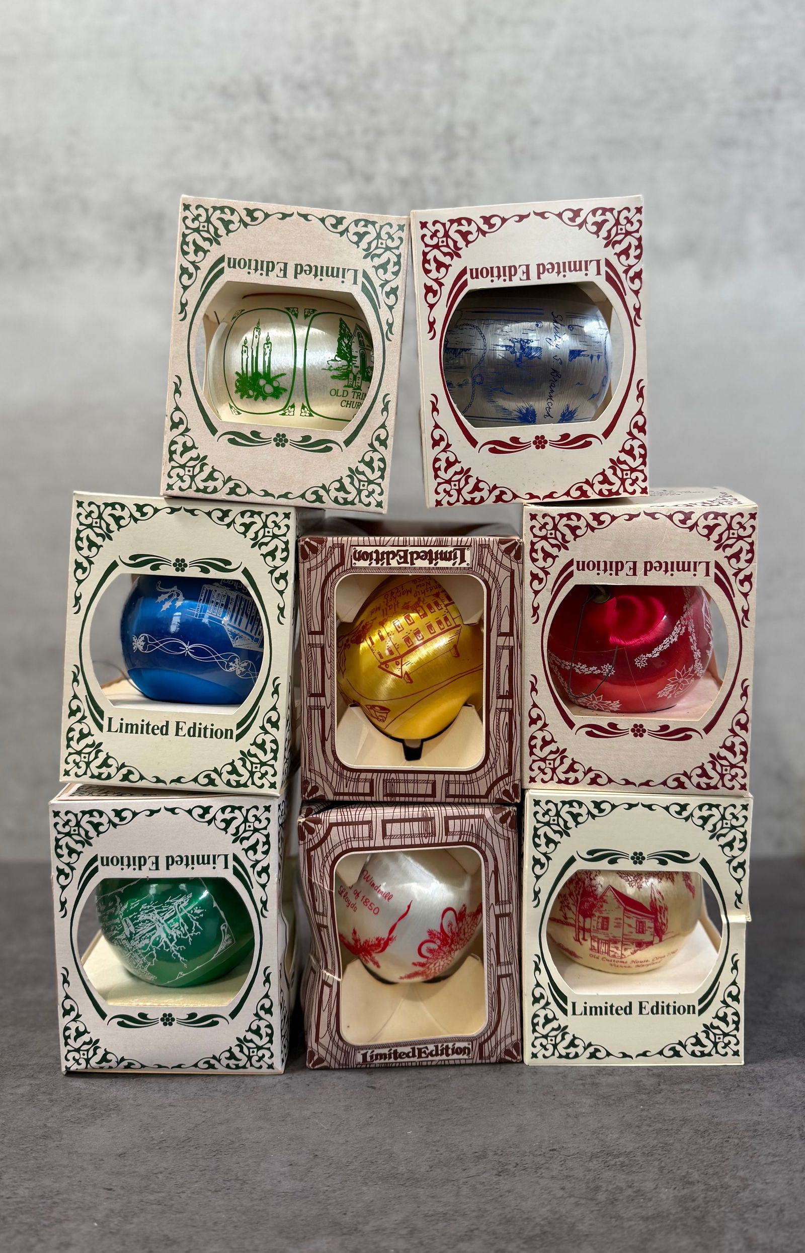 Lot of 7 Vintage Limited Edition Christmas Ornaments, Silk Wrapped Decorative Holiday Baubles in Box: A collection of seven vintage Christmas ornaments, each presented in its original box and marked as limited edition.These ornaments feature silk-wrapped surfaces with printed scenic and decorative