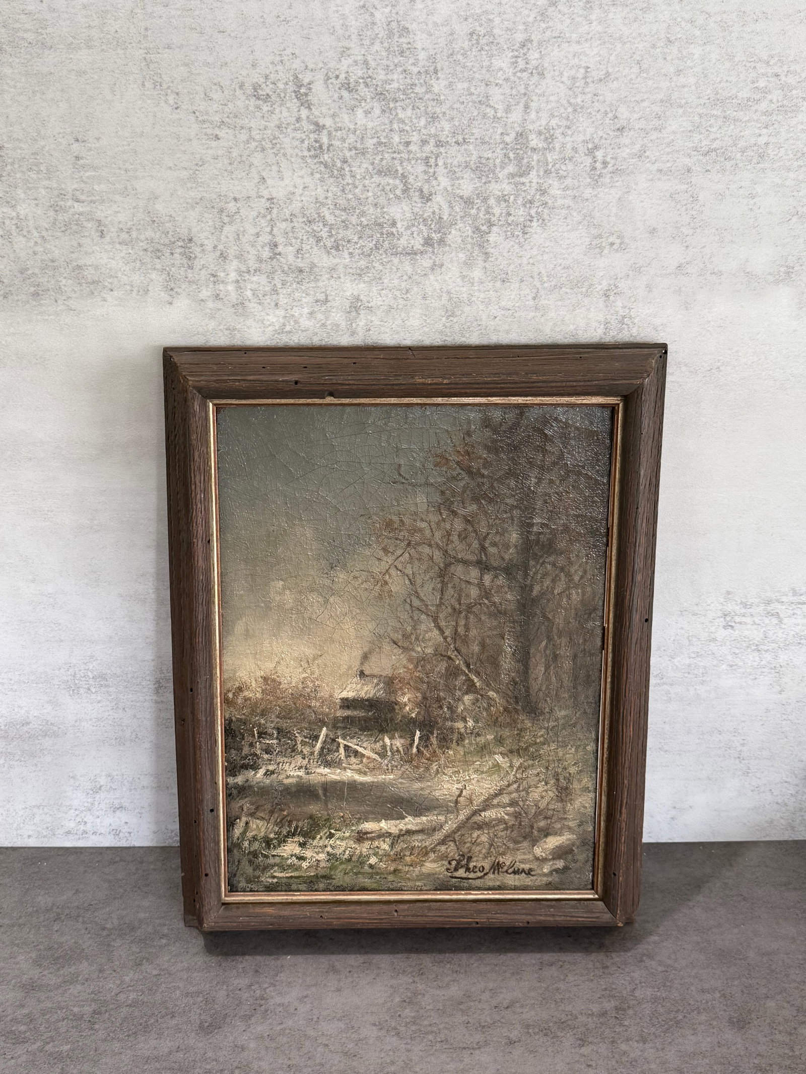Theo McLane Signed Winter Landscape Oil on Canvas Painting: Oil on canvas landscape painting depicting a quiet winter rural scene with a cottage beside partially frozen water and bare trees under a muted sky. Executed in an impressionistic manner with