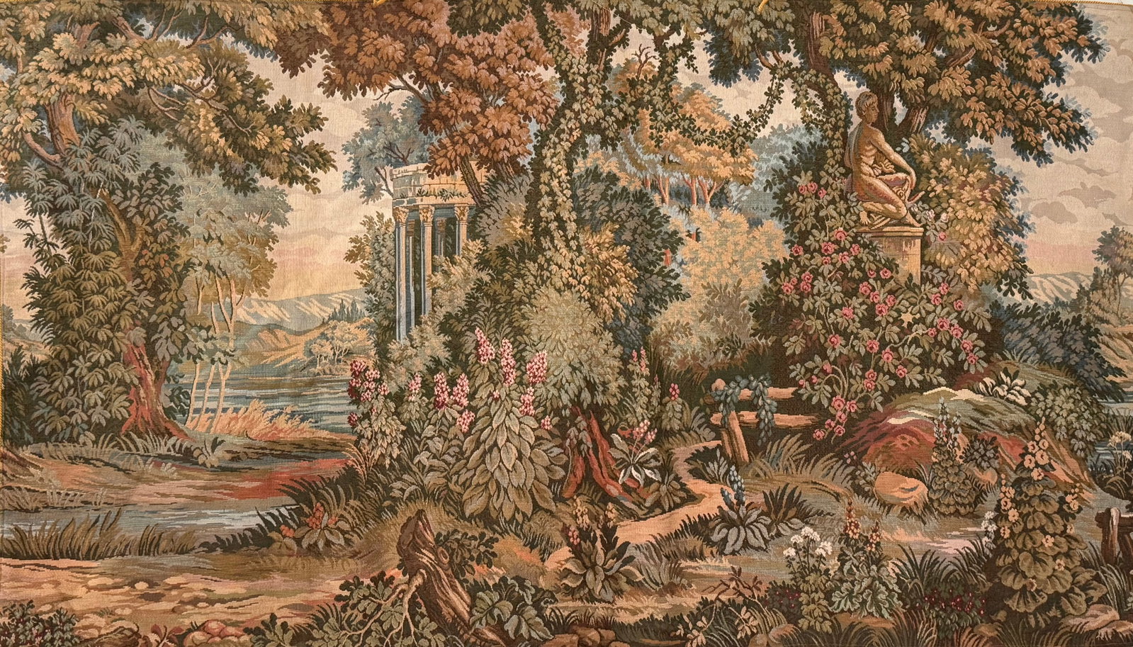 French Style Verdure Pastoral Tapestry with Classical Garden Scene: Featuring an elaborate verdure pastoral landscape with lush foliage, classical statuary, floral elements, and river scenery rendered in rich woven detail. Executed in the French decorative taste with
