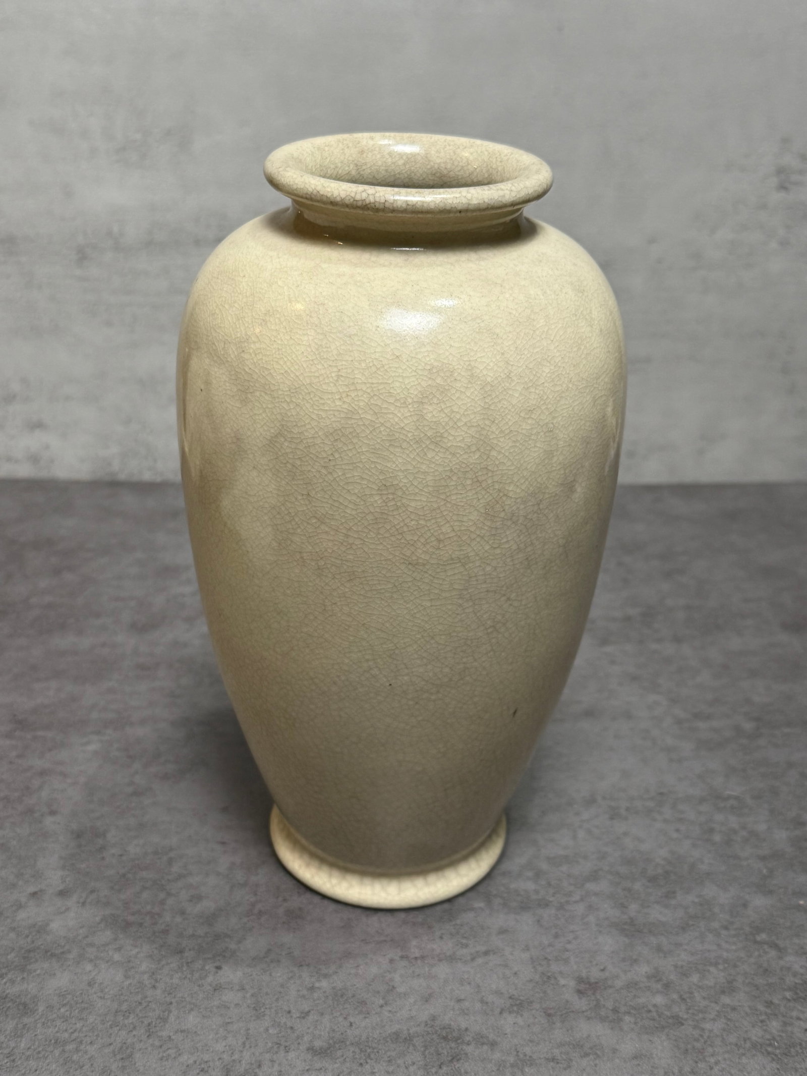 Chinese Crackle Glazed Porcelain Vase Mounted as Lamp Base: Chinese porcelain vase featuring a creamy ivory crackle glaze in a classic monochrome finish. The vase is potted in an elegant baluster form with broad shoulders and a gently tapered foot, covered