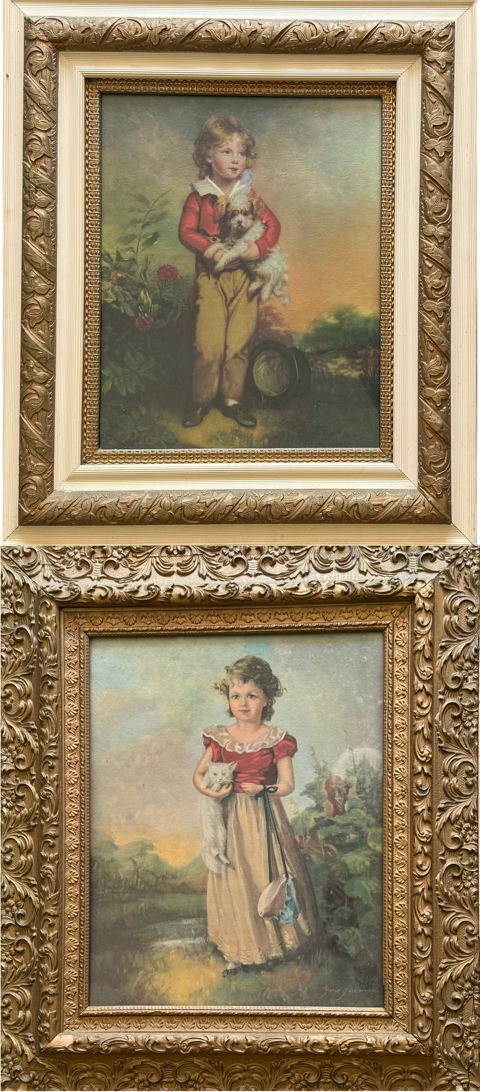 Pair Of Framed Victorian Style Child Portrait Oil Prints: Charming pair of framed oil print portraits depicting young children holding pets in pastoral landscape settings. One featuring a boy with a small dog, the other a girl holding a white kitten. Present