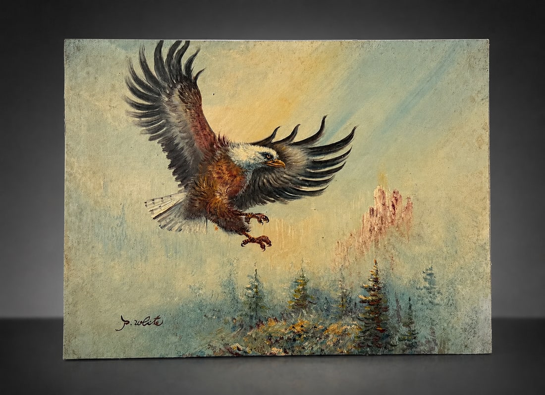 SIGNED BALD EAGLE LANDSCAPE OIL PAINTING: A signed oil painting depicting a bald eagle in flight above a mountainous evergreen landscape. Signed lower left. Expressive brushwork with a muted atmospheric palette. Measures approximately 12 x 16