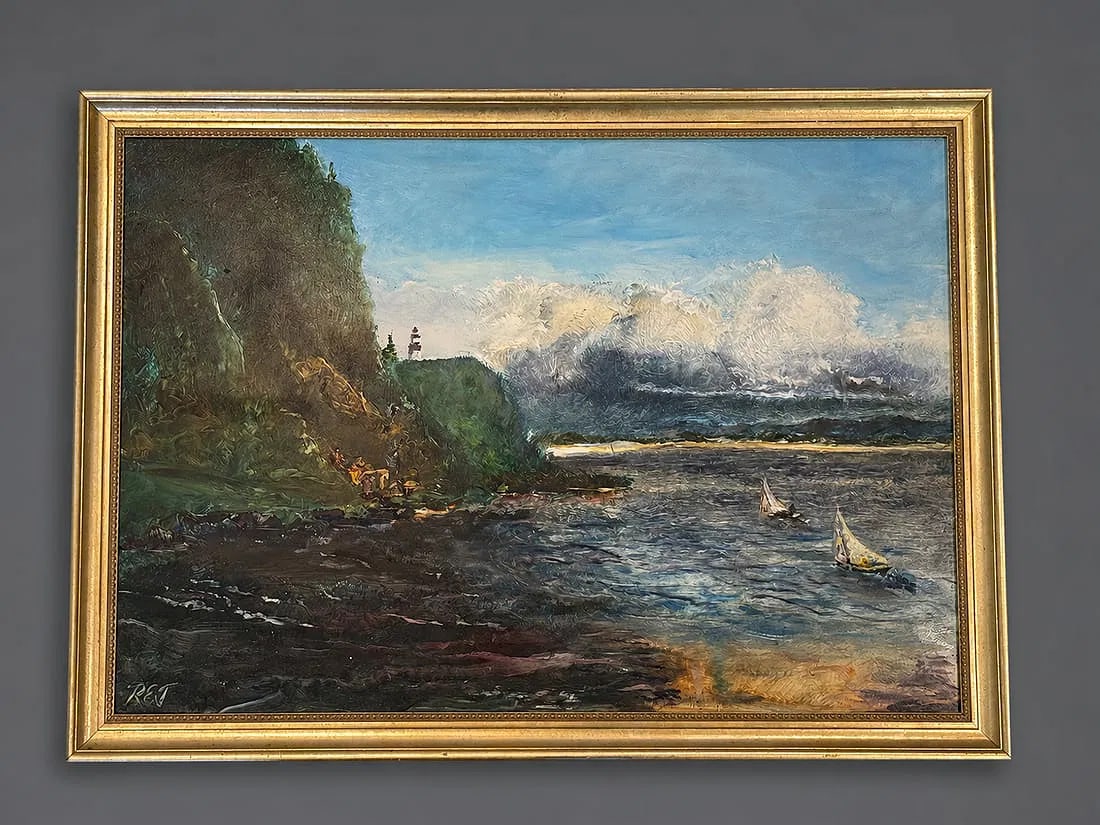 Signed Coastal Seascape Oil Painting in Gilt Frame: A signed coastal seascape oil painting depicting sailboats navigating calm waters beneath dramatic clouds, with a rocky shoreline and lighthouse in the distance. Richly textured brushwork and expressi