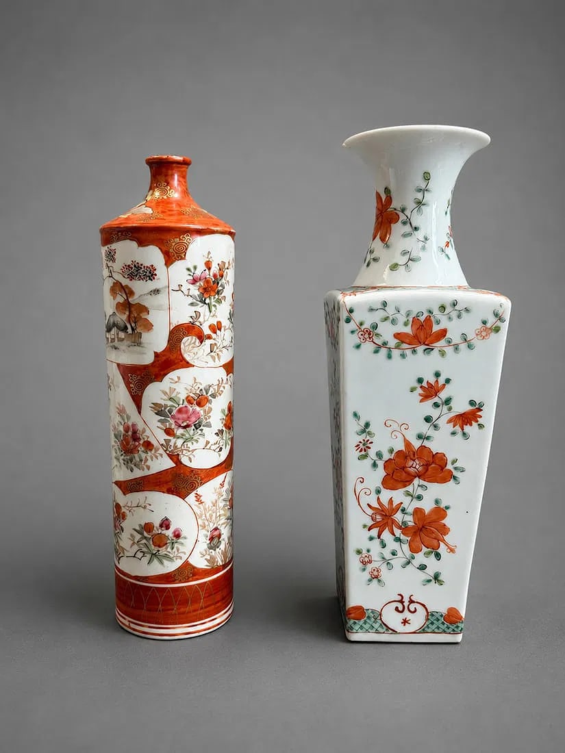 Asian Hand-Painted Porcelain Vases: A decorative pair of Asian hand-painted porcelain vases, each featuring a distinct form and floral decoration. One cylindrical vase is decorated with alternating landscape and floral reserve panels ac