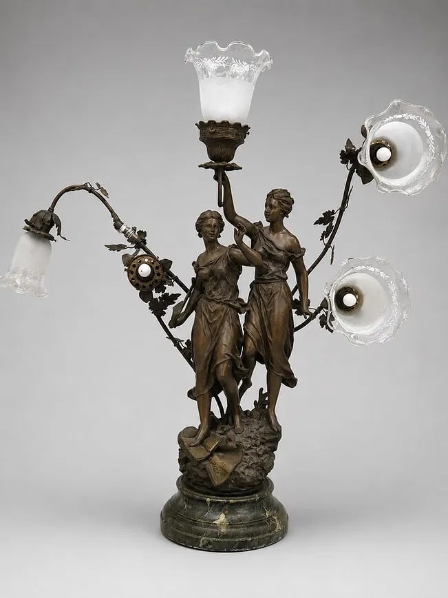 Antique French Style Figural Four-Light Table Lamp with Marble Base: An impressive antique French-style four-light table lamp featuring two finely modeled classical female figures supporting scrolling foliate arms fitted with four etched frosted glass shades. Richly de