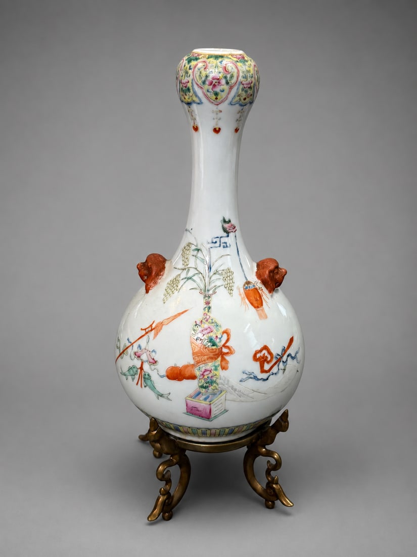 Chinese Famille Rose Porcelain Garlic-Head Vase with Applied Handles: A Chinese famille rose porcelain garlic-head vase, finely decorated in polychrome enamels with auspicious objects, floral motifs, and ribboned emblems. The elongated neck is decorated with floral and 