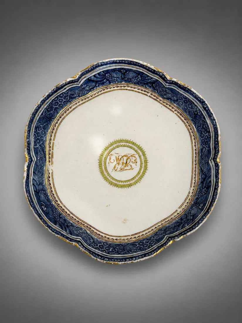 Antique European Style Porcelain Cabinet Plate with Cobalt Blue Border and Gilt Monogram: Antique European porcelain cabinet plate featuring a scalloped rim with an ornate cobalt blue border highlighted by gilt accents. The center displays an elegant gilt monogram "W" enclosed within a