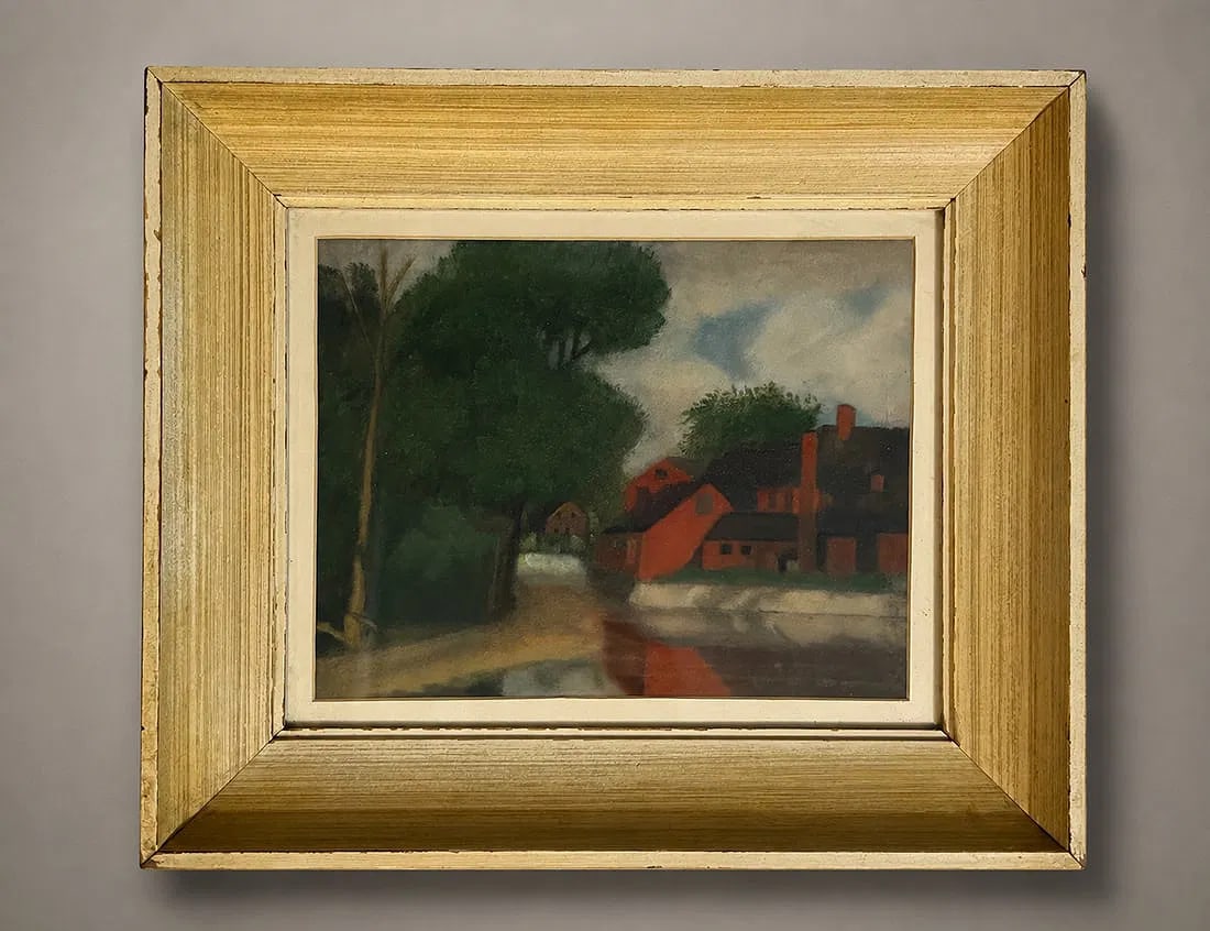 Framed Oil Painting of a Waterside Village Scene, 10 x 13 Inches: Oil painting depicting a tranquil waterside village with red buildings nestled among mature trees. Rendered in a soft, atmospheric palette, the composition captures a peaceful rural landscape with ref