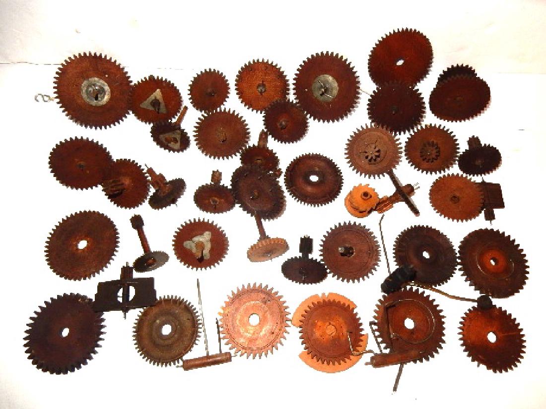 Early Wood Clock Gears/Wheel And Extras: Lot includes 36+ wooden gears of various style and 5-6 extra clock parts. Condition overall very good with only a few minor gear teeth chips. ''Provenance Egon Vicai Estate Gates Mills Ohio''
