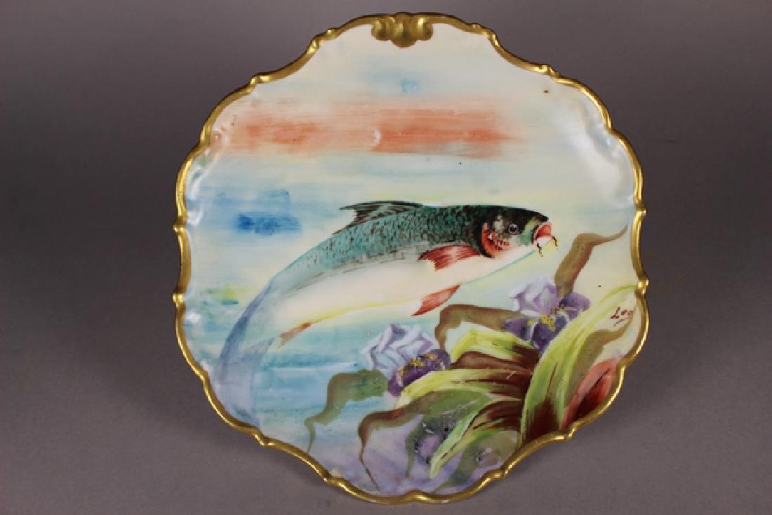 LDBC Flambeau Limoges Plate Hand Painted Fish PLate: ca 1900 LDBC Flambeau Limoges, France, hand painted plate with polychrome carp fish design signed on recto l.r. "Leo." Green stamp on back from LDBC, original hole from where the plate would've been h