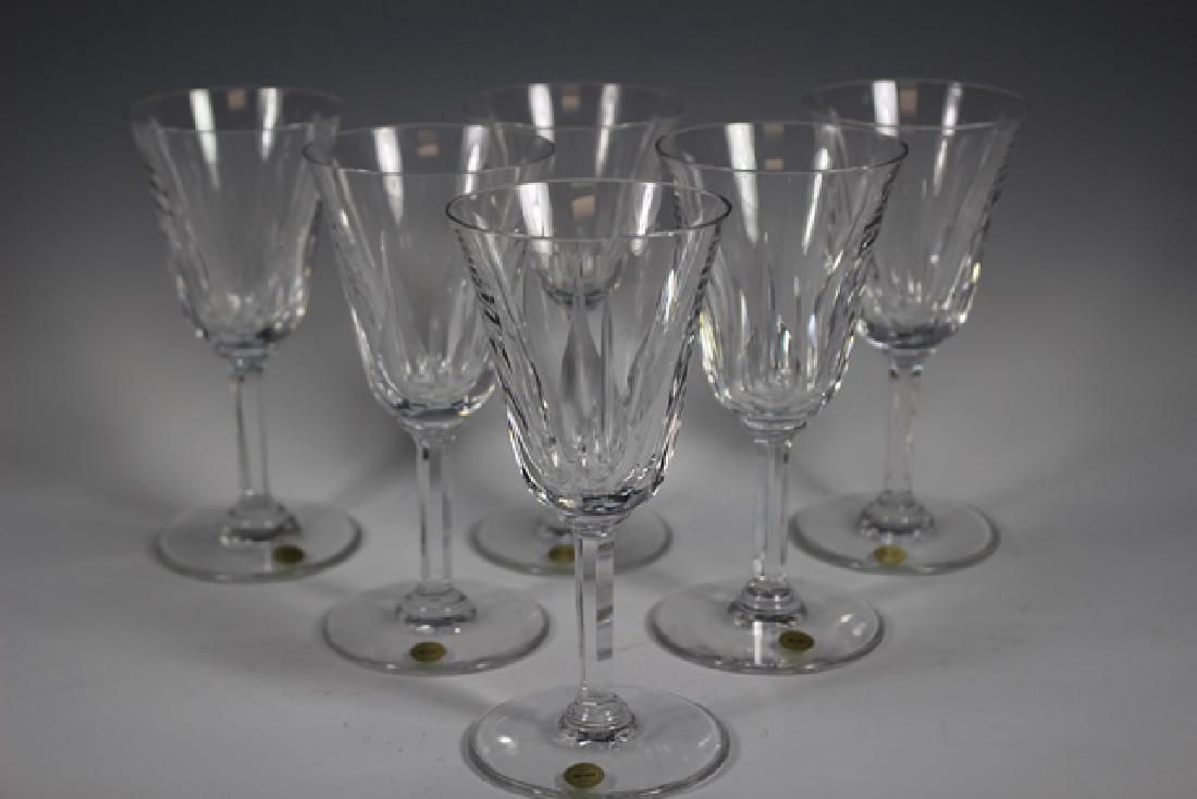 Set of 6 French Saint Louis Crystal Wine Stems: 6.5" tall in like new condition. Provenance: From Cedar Fairmont Antiques. 40yr old Cleveland, OH antique store specializing in French and European Antique, Jewelry and decorative arts.