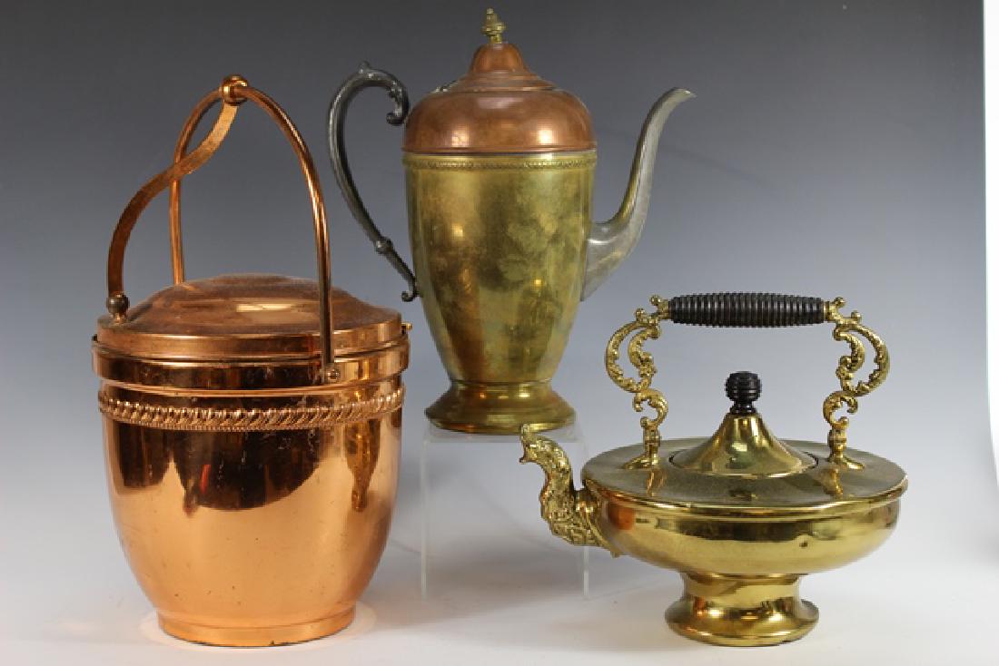 Ornate Brass Kettle and Copper Ice Bucket: Nice group of three serving pieces. Including BUFFALO MFG polished brass kettle with ebonized handles, copper and brass chocolate pot and copper ice bucket with pyrex glass insert (hinge loose see pho