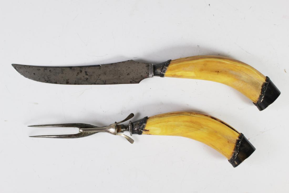 19th Century Whale Tooth Handle Carving Set: Knife and fork carving set with whale tooth handles and sterling silver mounted as shown. Stamped also on knife blade "Universal L.F. &Co". Used and age appropriate wear throughout as shown. See photo