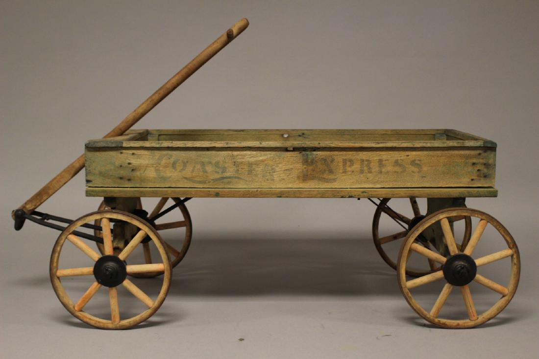 Coastal Express Spoked Wheel Wagon: Ca. 1900-1910 "Coaster Express" antique wagon with original green paint and orange wood wheels. Approx. 45" by 16" by 16". Overall good condition, see photos.