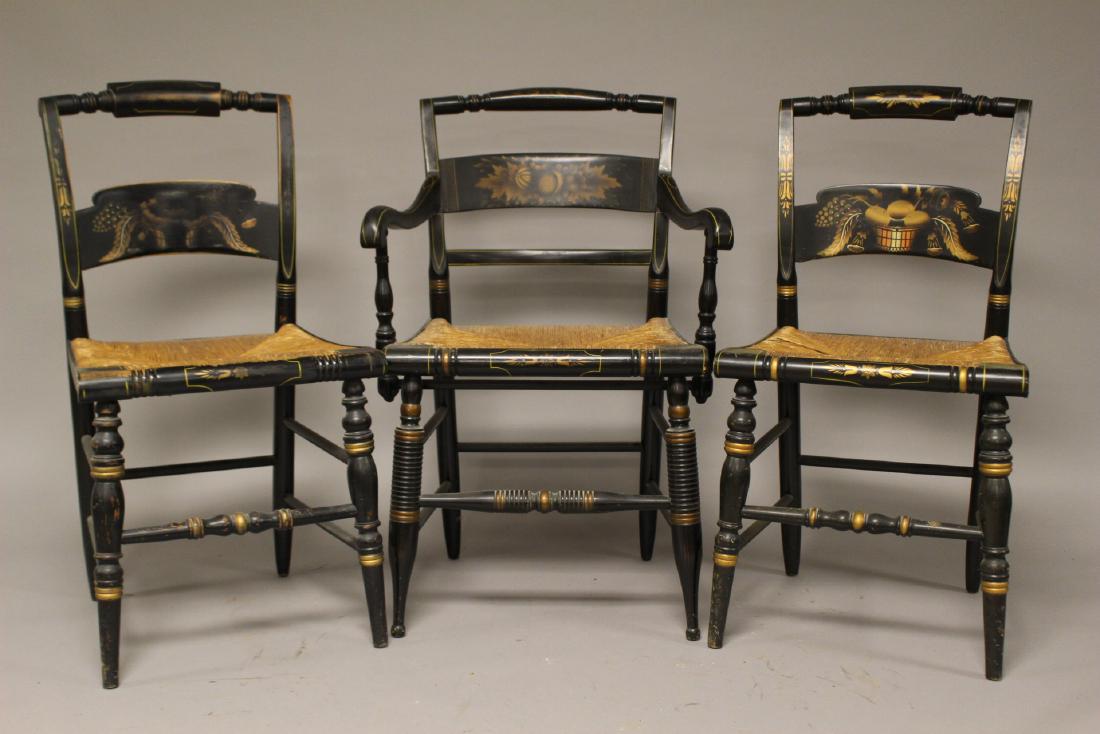 Three Early Hitchcock Chairs: Early 19th century, American, Hitchcock chairs includes two side chairs and one armchair. All original age appropriate condition with signs of use. Note; see photos for dust soil and original stencile