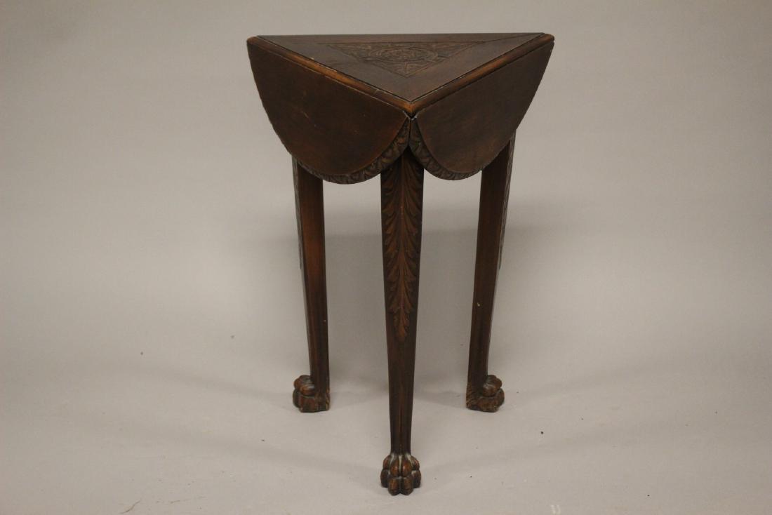 19th Century American Oak Table: Small triangular drop side cocktail table. Having small claw feet, carved legs and a swivel top as shown. 27" h x 12" each side. Some light signs of use and minor wear. See photos.