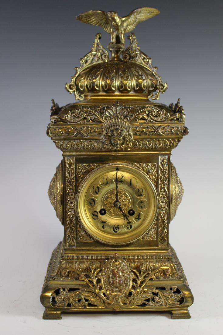 Fine 19th C. French Renaissance Gilt Brass Clock: Ornate 19th century brass gilded mantle clock with a renaissance motif with the probably J. MARTI FRENCH BRASS RENAISSANCE REVIVAL-STYLE MANTLE CLOCK WITH EAGLE FINIAL. Late 19th/Early 20th Century.. 