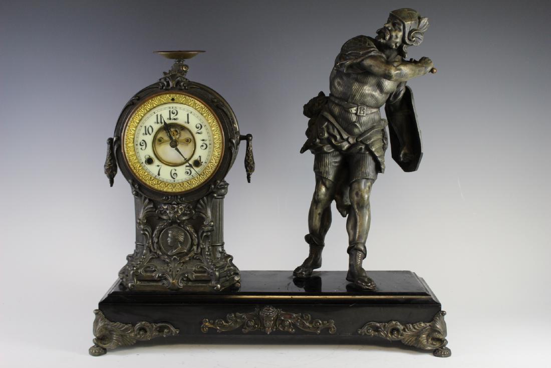 New Haven Clock WARRIOR Figural Clock: Fabulous American figural mantel clock by New Haven Clock Co. late 19th century standing warrior next to clock on pedestal with enameled dial and mounted on painted metal base with ormolu feet and dec