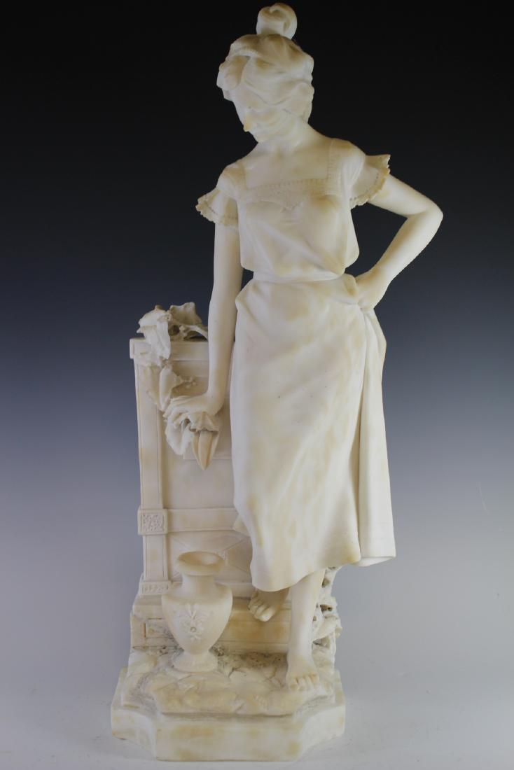 Adolfo Cipriani Alabaster Woman Figure: Italian carved alabaster "Girl At The Fountain" by Adolfo Cipriani. White alabaster Victorian beauty standing at the well. Approx. 31"t. x 12"w. x 10"d. Condition; having broken thumb, small loss to l