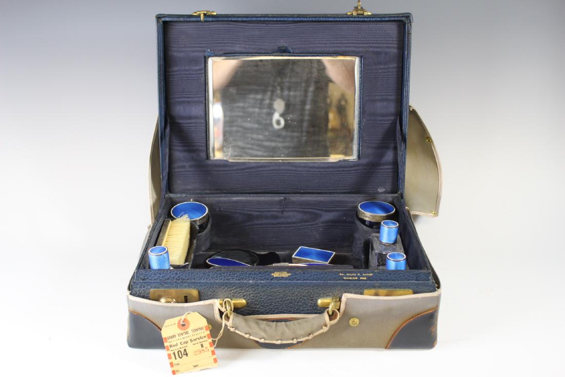 Cartier Traveling Ladies Vanity Set Sterling: Cartier set includes 5 etched glass bottles and jars with French silver collars and lids, complete nail grooming kit with shoe horn, 1 brush, 1 pills box, 1 vanity mirror set in blue French enamel and