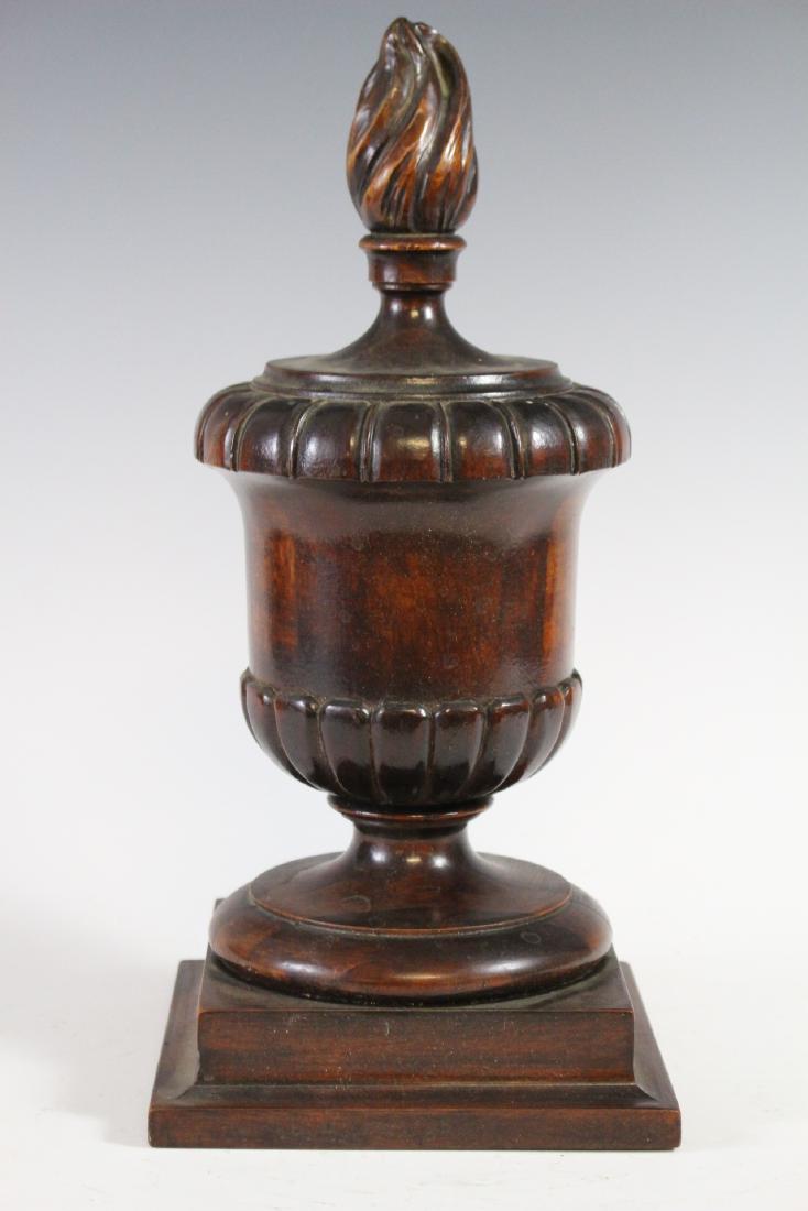 19th Century Flamed Urn Finial: 19th Century carved mahogany urn with turned flame top. Architectural finial possibly a newel post. English mid 19th century. Standing approx. 14" tall on mounted square base. Condition is good, see p