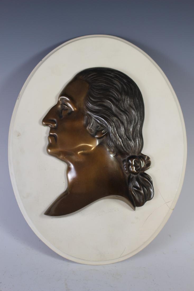 Thomas Jefferson Bronze Portrait Plaque: Cast bronze bust or side portrait of Thomas Jefferson mounted to Oval wood plaque. Bronze measuring approx. 11" h x 8" w. Faded name on plaque area. Removable with two screws on verso, see photo.
