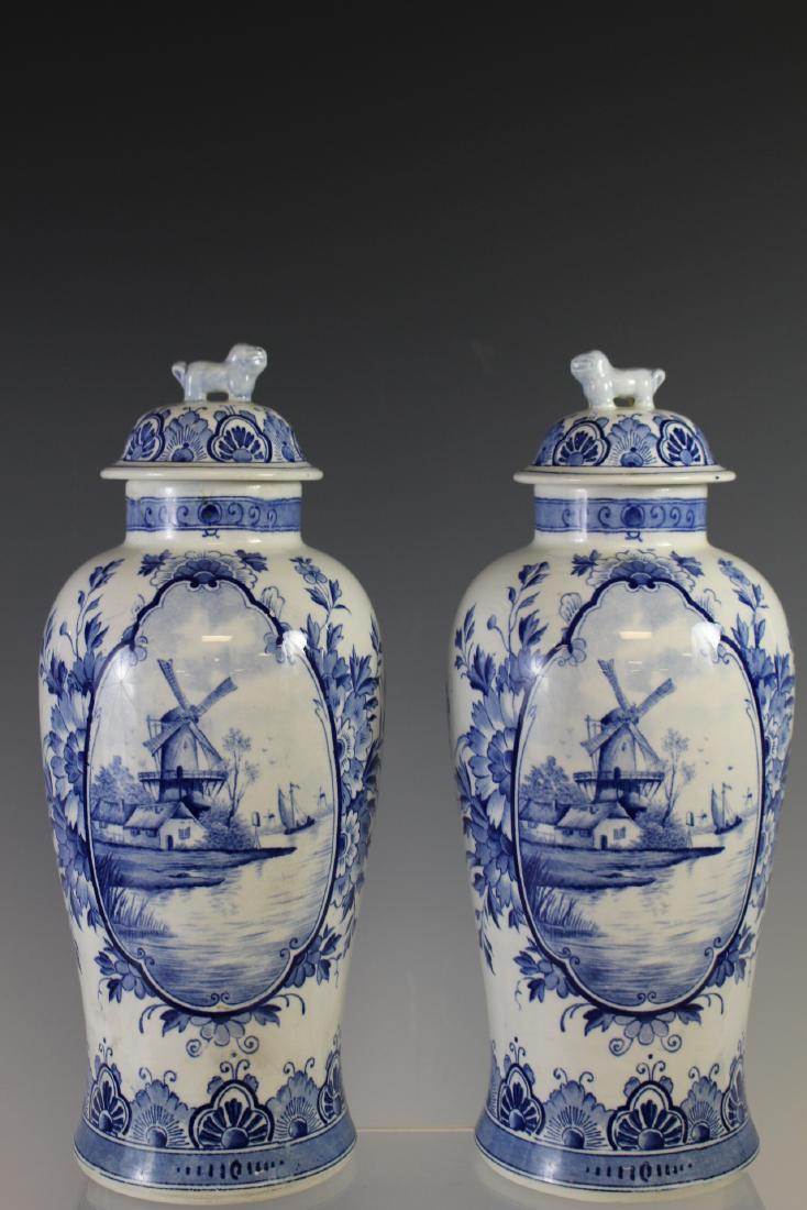 Chinese Export For Dutch Delft Ginger Jars: Pair of early 19th century Chinese export porcelain lidded ginger jar for the Dutch market. Having foo dog or lion finial lids as shown, Holland windmill medallion hand painted. Measuring approx. 12" 