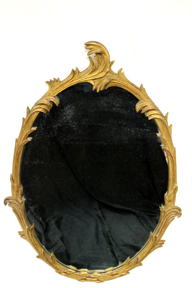 Gold Gilded French Oval Mirror: Early 20th century oval French wall mirror. Approx. 41" by 28". Light dust soil otherwise age appropriate condition.
