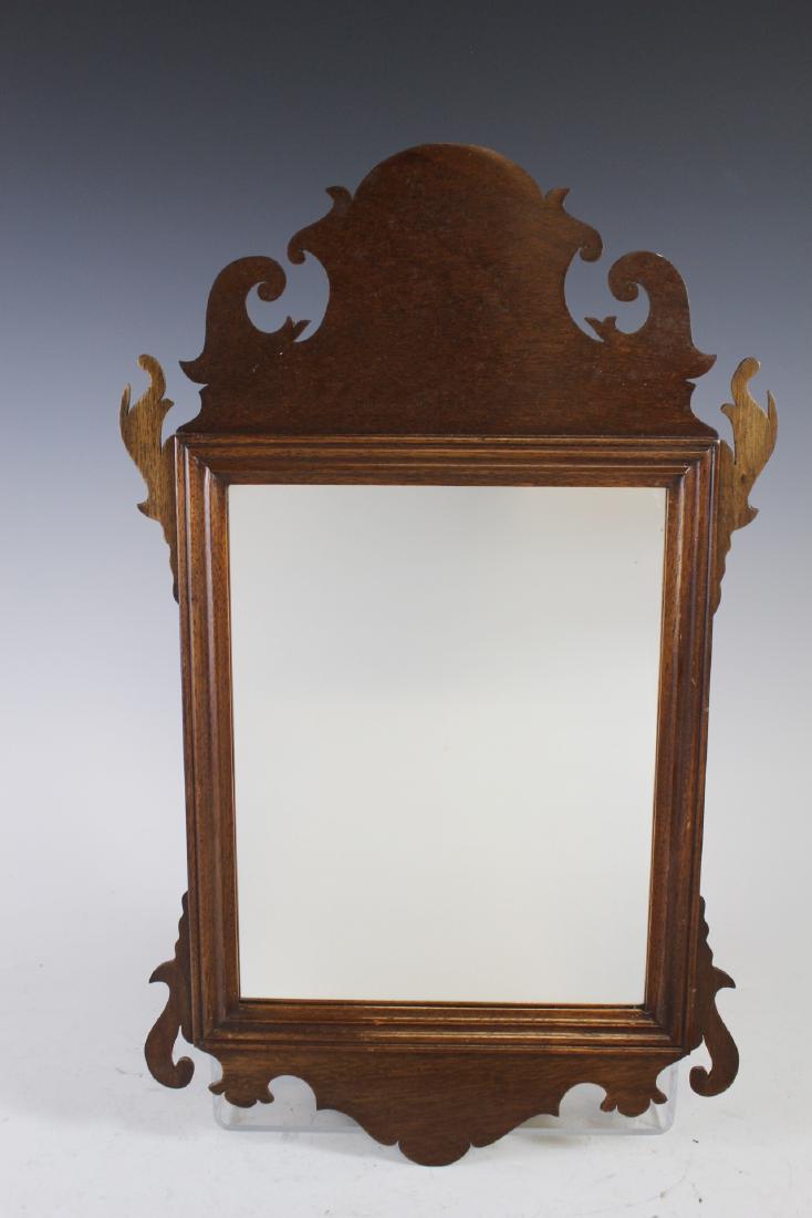 Kittinger Chippendale Style Wall Mirror: 20th century, Kittinger Furniture Company Chippendale style mirror in mahogany frame. Approx. 20" by 12". Overall condition is good, see photos.