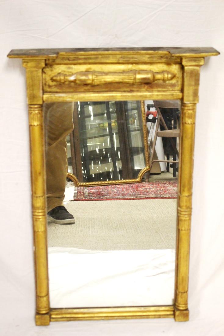 18th Century Gilded Mirror: Continental columned wall mirror. Approx. 30" t by 19.5" w. Light gesso loss consistent with age, see photos.