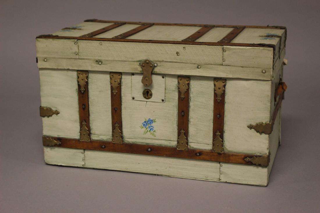 Early Oak Banded Childs Trunk: Late 19th. Early 20th. Century miniature doll trunk. Hand painted Oak with leather handles and having late restoration. Approx. 10.5" t. 18" w. 10.75" d. In good age appropriate condition, see photos.