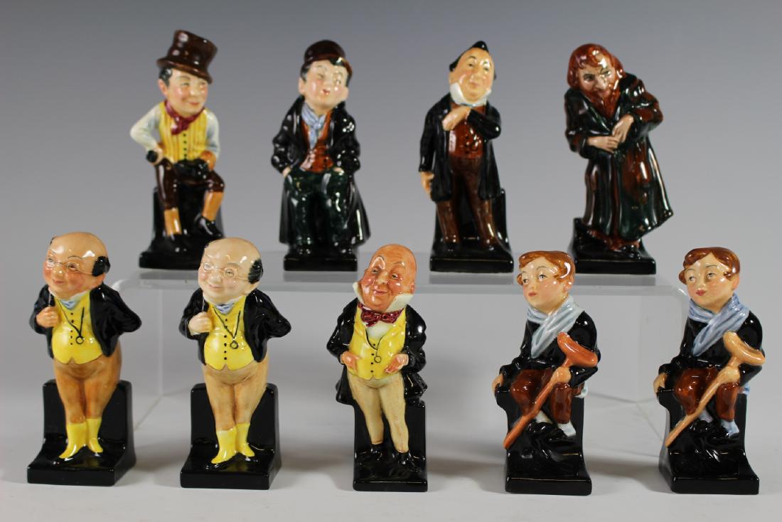 Nine Royal Doulton Figurines: Including Royal Doulton "Artful Dodger", "Pecksniff", "Fagin", (2) "Pickwick", "Sam Weller" note; does have hairlines on left side from top of hat to chest and on elbow, (2) "Tiny Tim" note; one has h