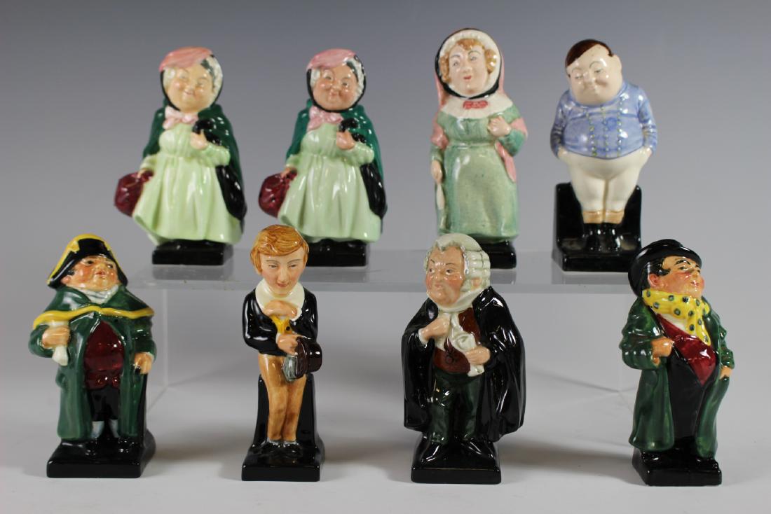 Eight Royal Doulton Figurines: Including Royal Doulton "Mrs. Bardeli", (2) "Sairey Gamp" note; one has hairline on back of head, "Fat Boy", "Buzfuz", "Tony Weller", "Bumble" and "David Copperfield". Approx. 4" tall. Good age approp
