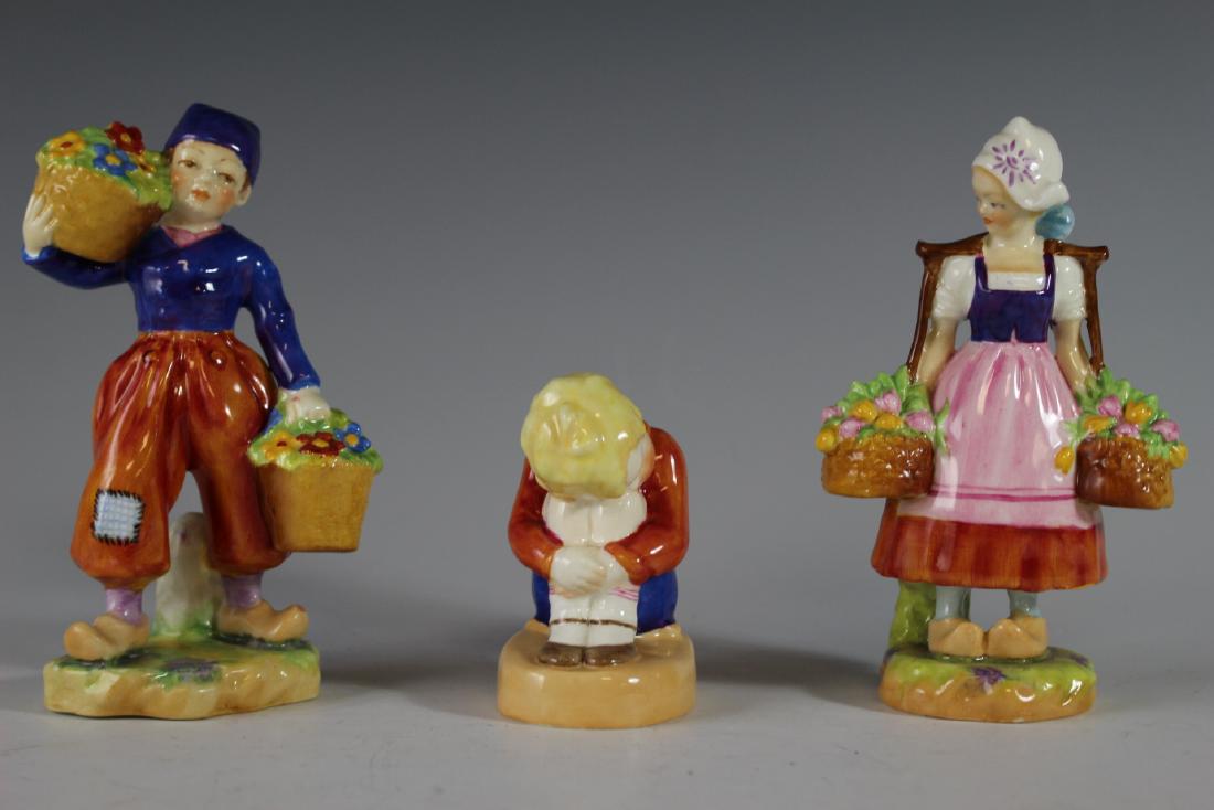 Three Royal Worcester Figurines: Including "Dutch Girl" 2922, "Dutch Boy" 2923 and "Sleepy Boy" 2918. All in good age appropriate condition, see photos.
