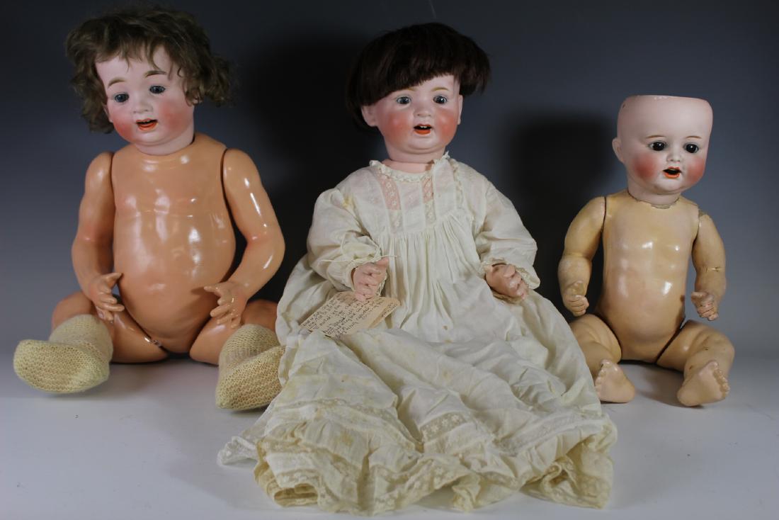 Three Antique Japan Bisque Head Dolls 18"-22": Including 18" marked *3005 Nippon P.45, no damage to head, no wig, small wig flakes, missing one toe and body wear. 20" marked MB Japan 14 with damage to left side of head, reglued backside of head an