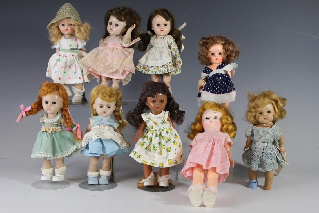 Nine Ca. 1950s Ginny And Ginny Type Dolls: Including one strung Ginny Vogue, two straight leg Ginny Walkers, two bent knee Vogue Ginny Walkers, one black Pam, one ginger and two other Ginny types. One has pink Betty McCall American H&F outfit.