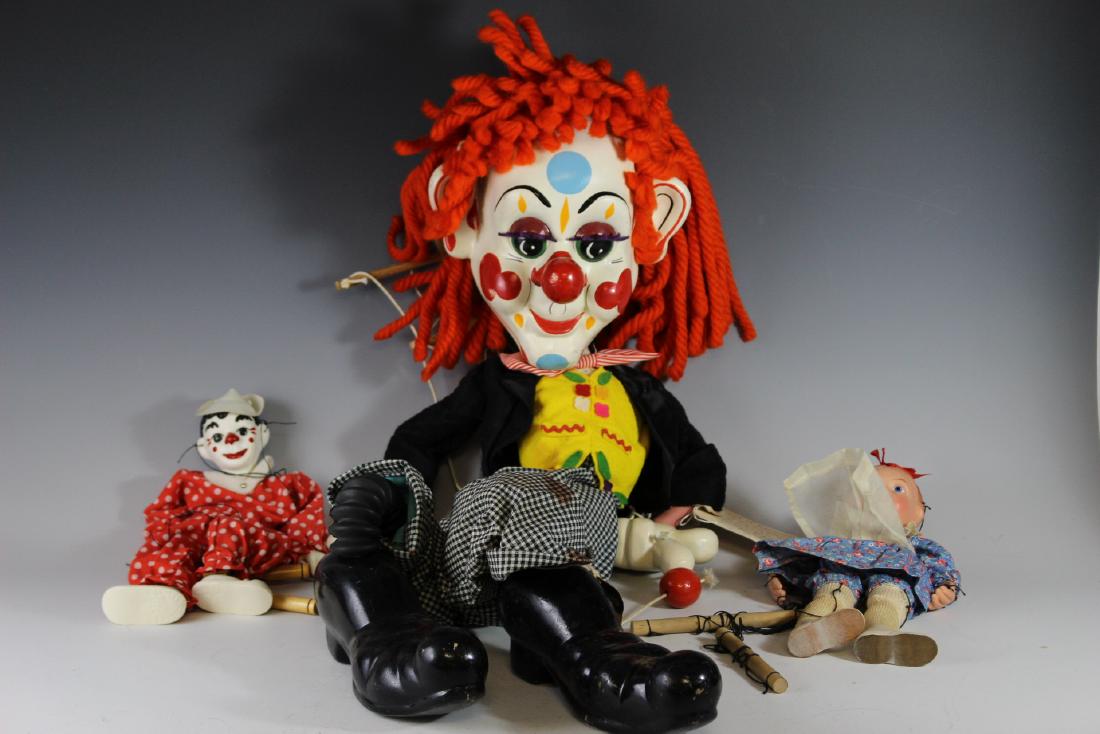 Three Marionette Puppets Inc. "Bimbo The Clown" Display: Including 42"Bimbo the Clown" store display by Pelham Puppets, "Emily Ann" by Effanbee and "Clippo the Clown" by Curtis. All in original clothing and all in good to excellent condition with light plat