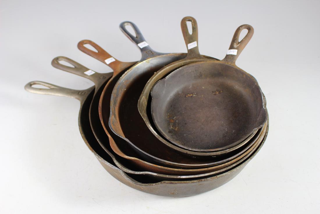 Collection of Six Griswold Cast Iron Skillets: Including cast iron skillet numbers three, four, six, seven, eight and nine. All in age appropriate condition with some surface rust, see photos.